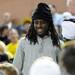 Michigan senior quarterback Denard Robinson smiles as he makes his way to the student section during the first half against North Carolina State at Crisler Center on Tuesday night. Melanie Maxwell I AnnArbor.com